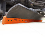 RoadMAXX motor grader underbelly carbide snow plow cutting edge blade system on underbelly plow